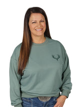 Women's Buck Skull Crew Pullover in Bamboo Green - Detail shot of Classic Buck Head logo by Girls with Guns